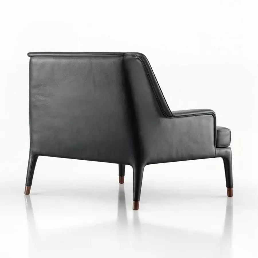 Superior Wayne Enterprises WE-111 lounge chair upholstered in sleek black leather with slender metal feet