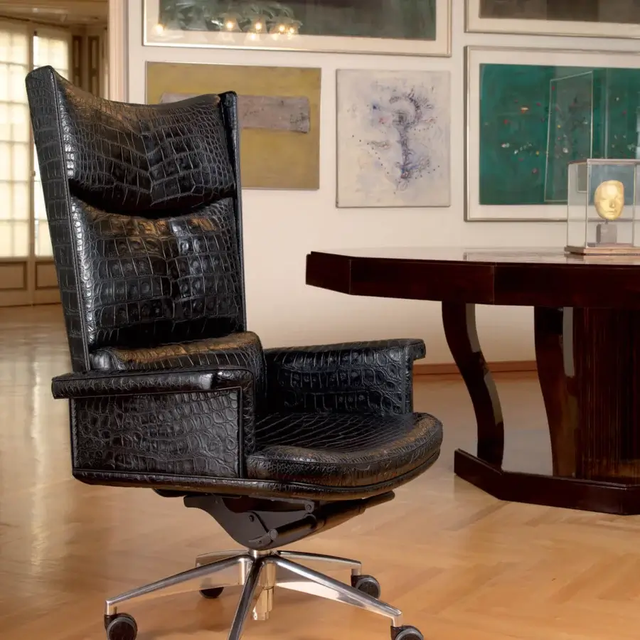 Distinguished Mascheroni Planet armchair crafted in dark leather with a five-spoke steel base and castors for mobility