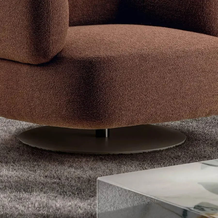 Captivating Lago Zeppelin lounge chair with warm brown textured textile upholstery and a swivel return mechanism