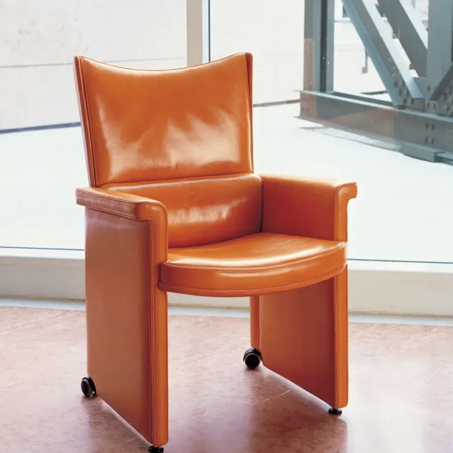 Lavish Mascheroni Planet V armchair with glossy orange leather upholstery and birch shaped wood structure