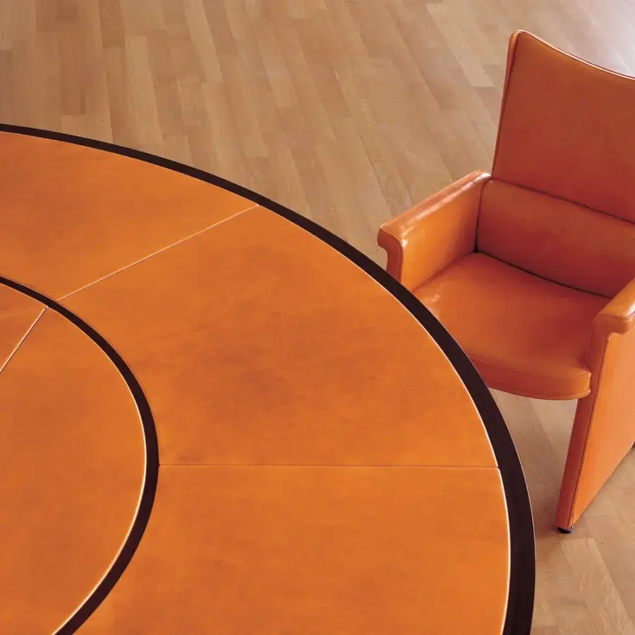 Distinguished Mascheroni Planet V armchair crafted in vibrant orange leather with a birch shaped wood structure and castors