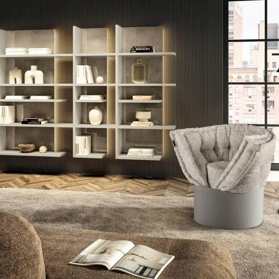 Distinctive Lago Huggy lounge chair with enveloping neutral gray patchwork fabric built from hand-sewn recycled materials