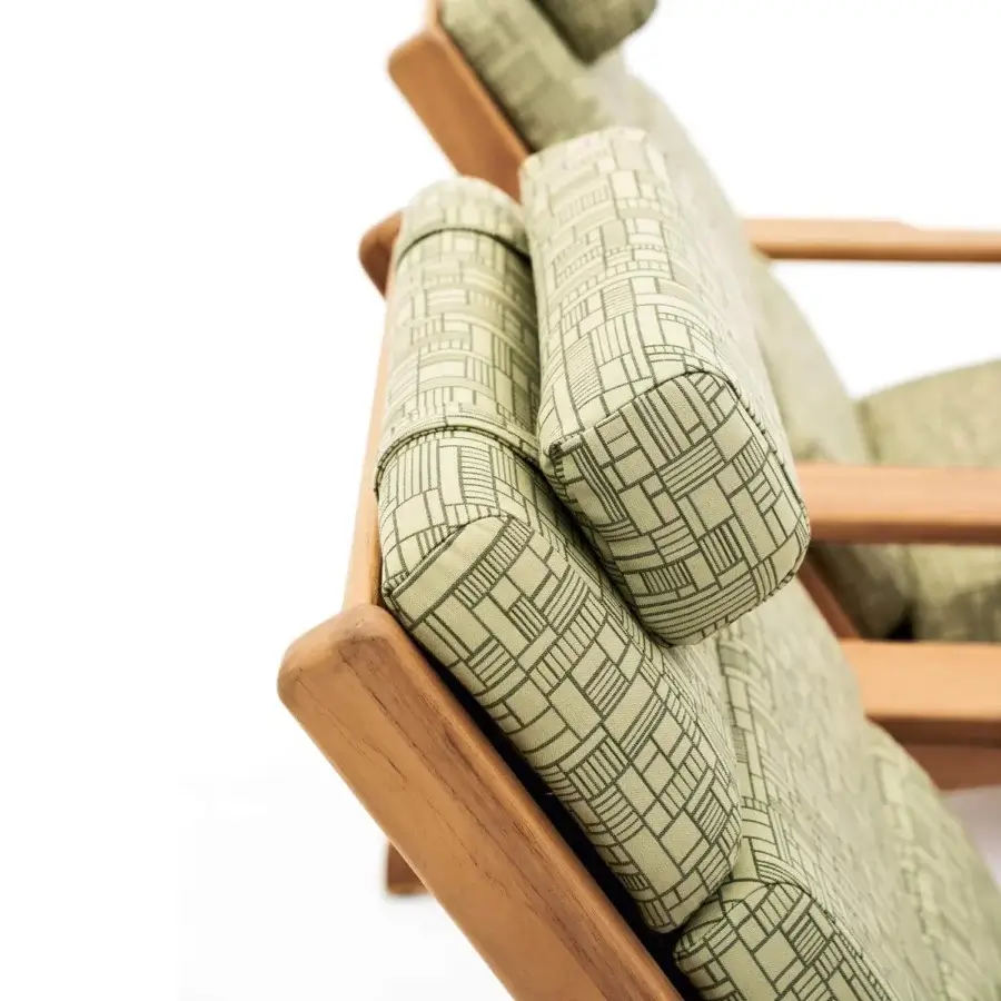 Exceptional Varaschin Bali Bergere lounge chair with light teak wood and soft beige cushions displaying a geometric pattern