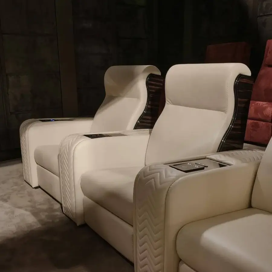 Superior Vismara Onassis Home Cinema seating in Coconut Milk fine-grained leather with quilted armrests and polished Ebony Makassar accents