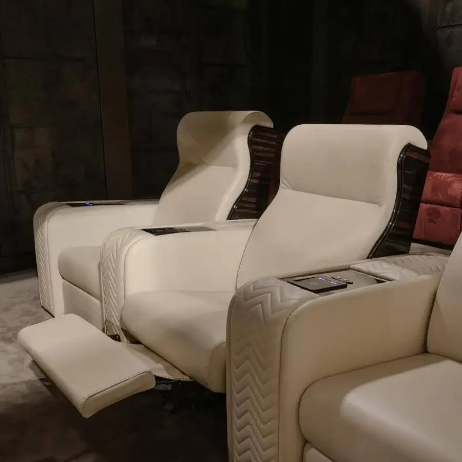 Elegant Vismara Onassis Home Cinema seating in Coconut Milk fine-grained leather with polished Ebony Makassar accents and quilted chevron armrests