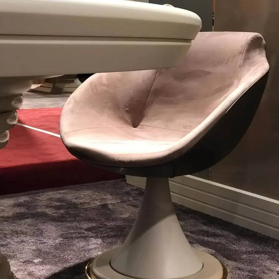 Distinguished Vismara Shell armchair crafted in muted pink Eco Nabuk with darker matte Top Grain leather and gilded wood base