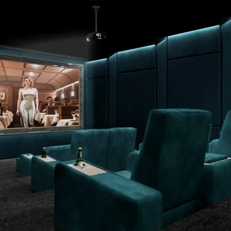 Elegant Vismara Comfort home cinema seating upholstered in dark teal velvety textile with bold stitches and lacquered wood top