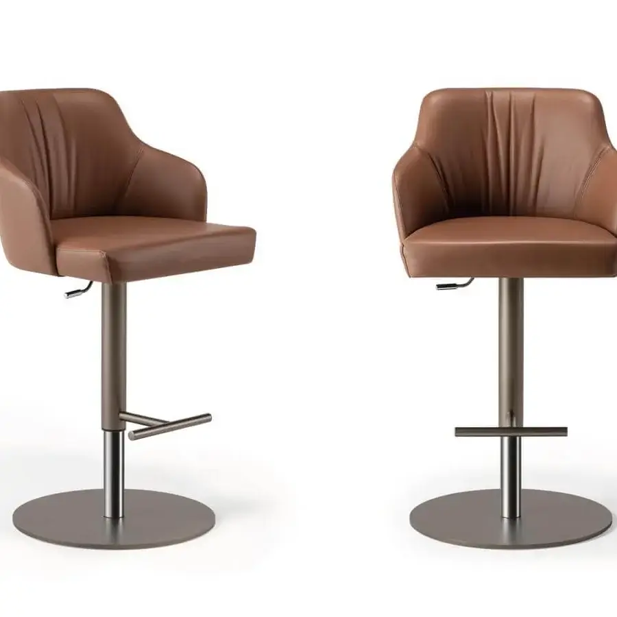 Distinguished Reflex Comfort stool with padded brown textile upholstery and satin Brass metal base including a footrest