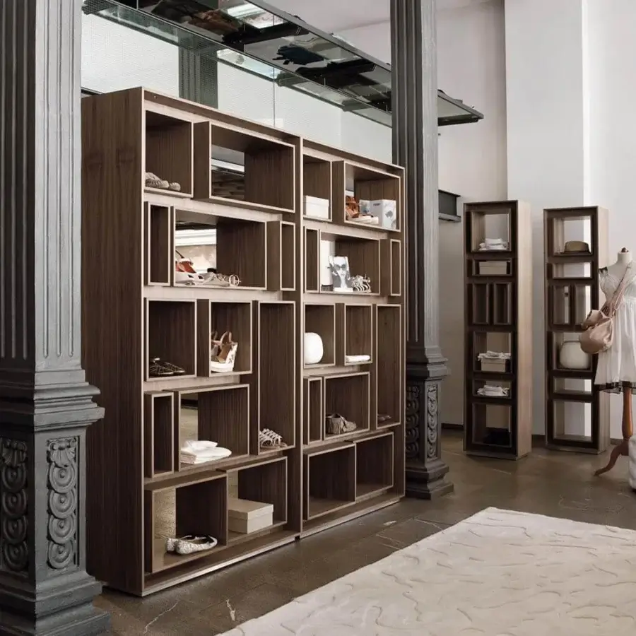 Distinguished Porada First bookcase with dark brown canaletto walnut and light metal outlining a grid-like structure and visible wood grain