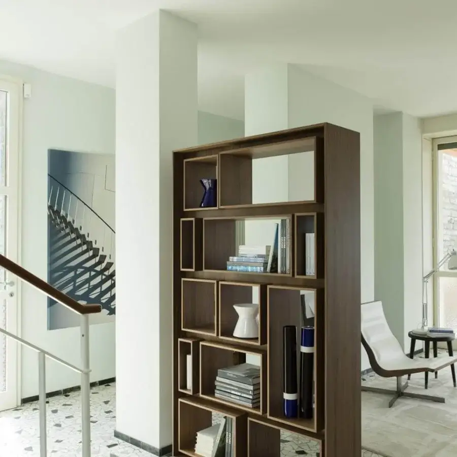 Exceptional Porada First bookcase with geometric compartments crafted in canaletto walnut and subtly finished steel with a smooth matte finish