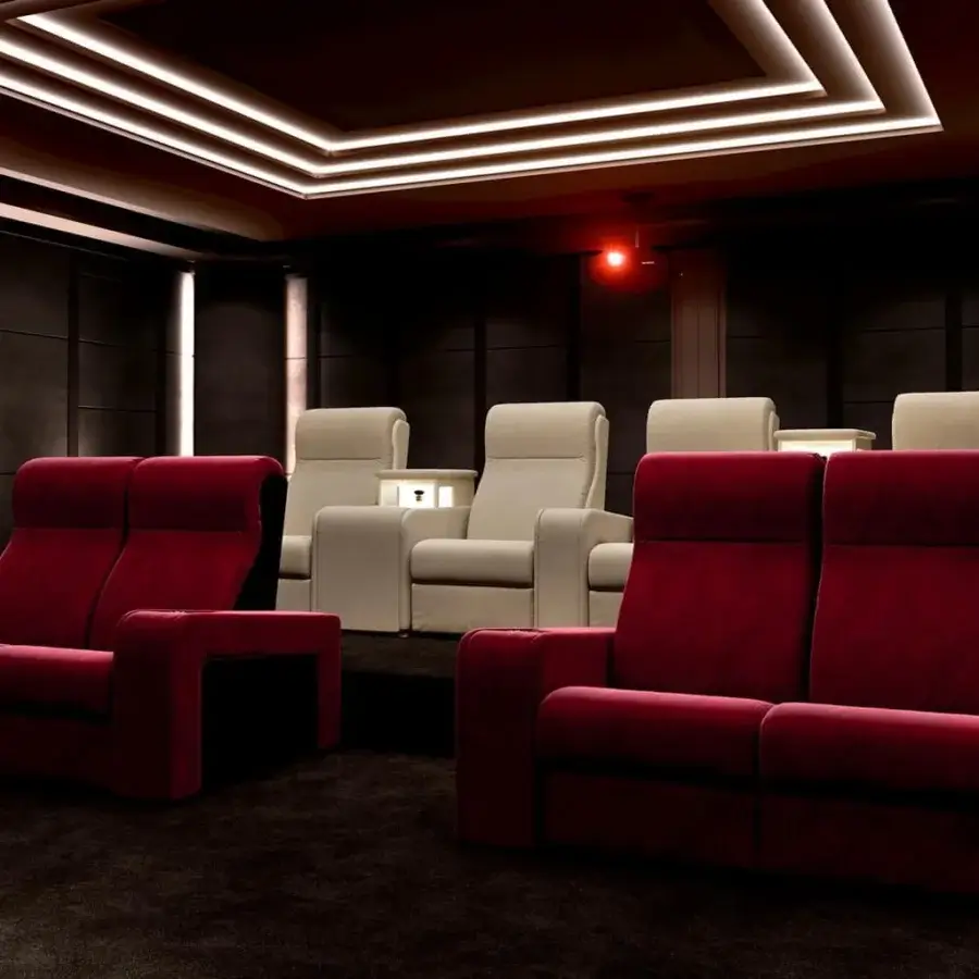 Distinctive Vismara Luxor home cinema seating with deep red fabric upholstery and glossy lacquered wood armrests including chrome steel cupholders