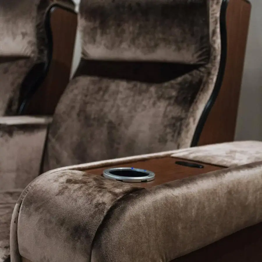 Distinctive Vismara Luxor home cinema seating with supple brown upholstery and lacquered wood armrests in matte finish