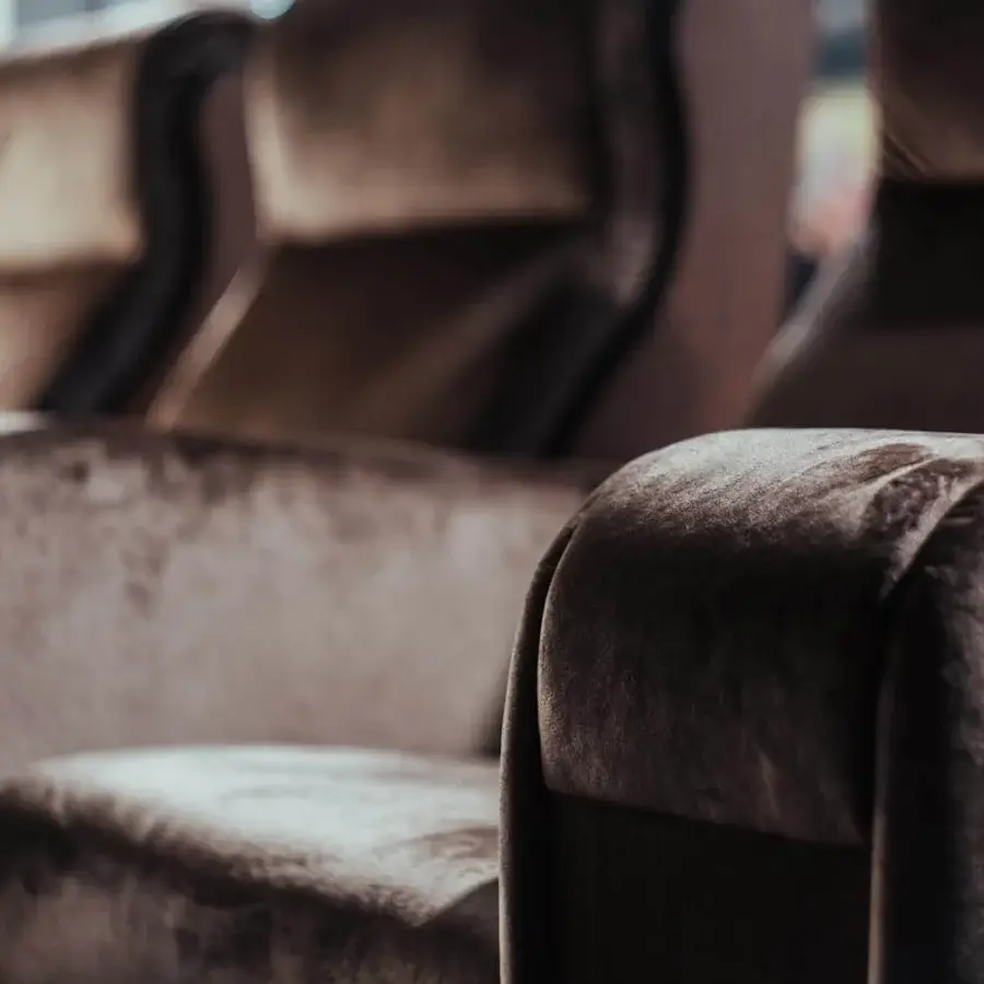 Innovative Vismara Luxor home cinema seating with rich brown textile upholstery and glossy lacquered wood components
