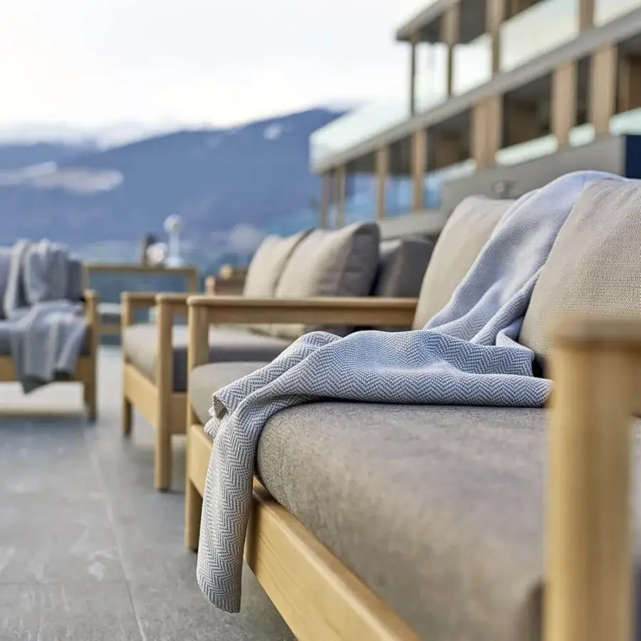 Distinguished Varaschin Bali sofa crafted with plantation-certified solid teak and textured gray textile upholstery for outdoor seating