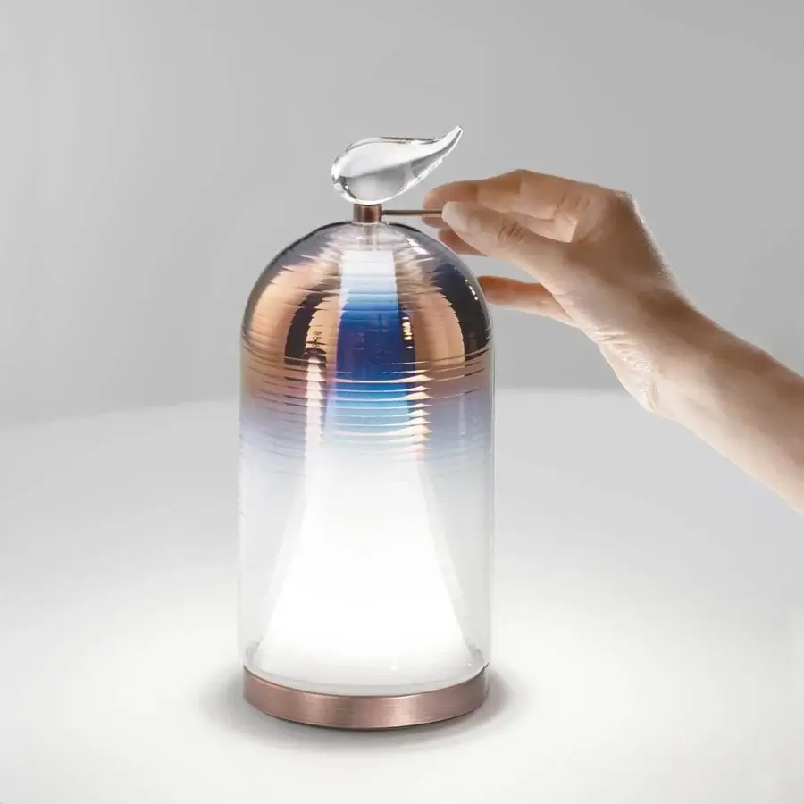 Elegant Italamp Martina table lamp with shaped blown glass and white glass, crafted in copper and brushed copper finish