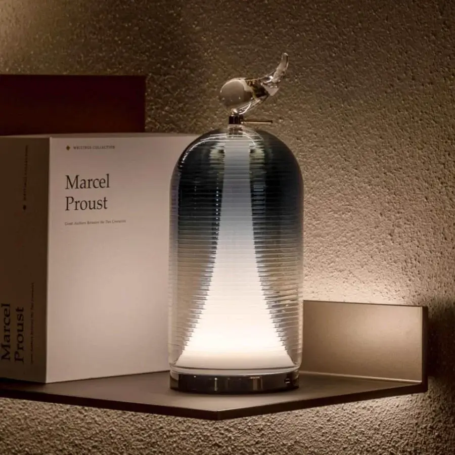Distinguished Italamp Munetta table lamp with shaped blown glass in a blue shaded finish and refined crystal detail