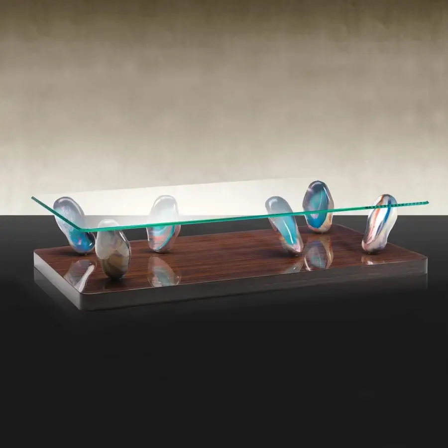Distinguished Reflex Sassi coffee table with swirling blue, white, orange, and brown Murano glass legs and extra-clear beveled glass top