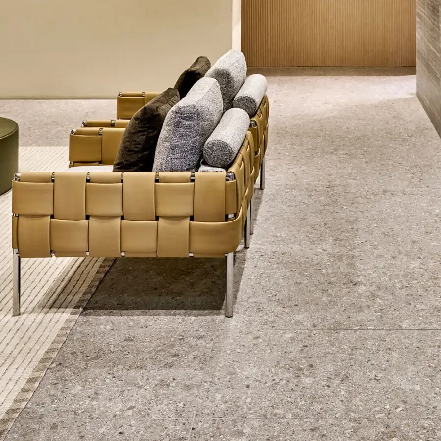 Superior Turri Ratio lounge chair with tan woven leather and gray textile cushions built with a sleek metal base