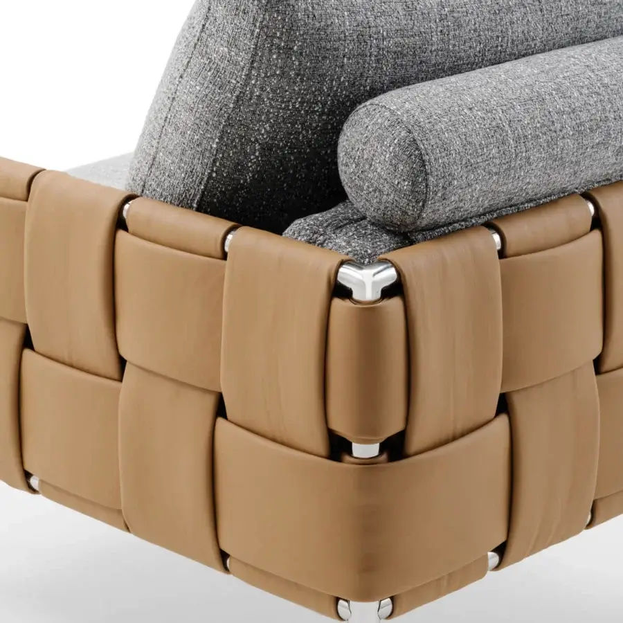 Captivating Turri Ratio lounge chair with woven light brown leather and luxurious gray cushions crafted in metallic joints