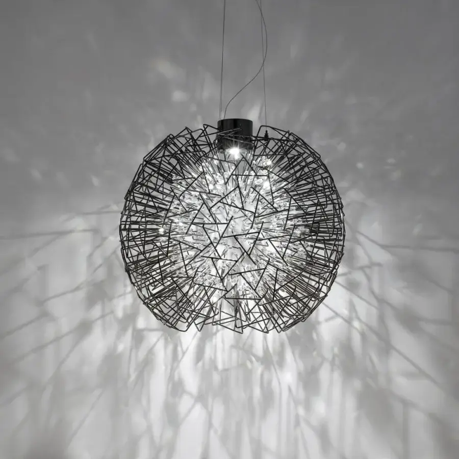 Superior Terzani Core suspension lamp with vibrant faceted crystal spheres breaking through dark-toned brass surface