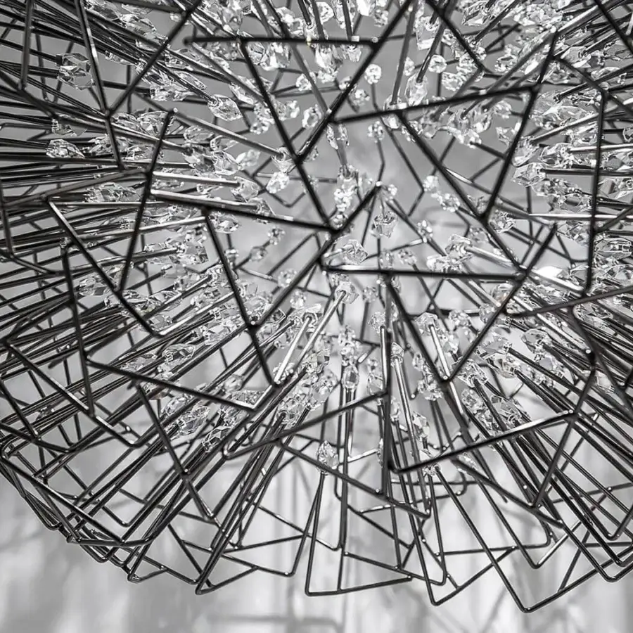 Elegant Terzani Core suspension lamp with a spherical framework of dark metal rods and multifaceted crystal elements