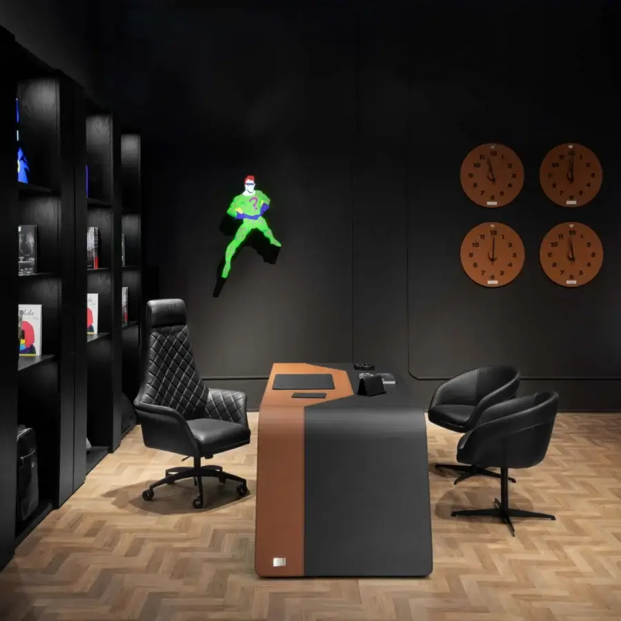 Exclusive Wayne Enterprises WE-137 armchair with sleek rounded silhouette in smooth matte black leather and central metal swivel base