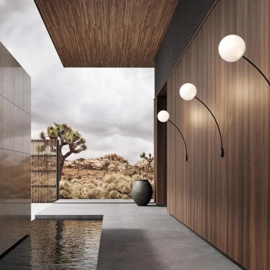 Refined Italamp Filo wall lamp with a white blown glass sphere held by a curved black metal arm
