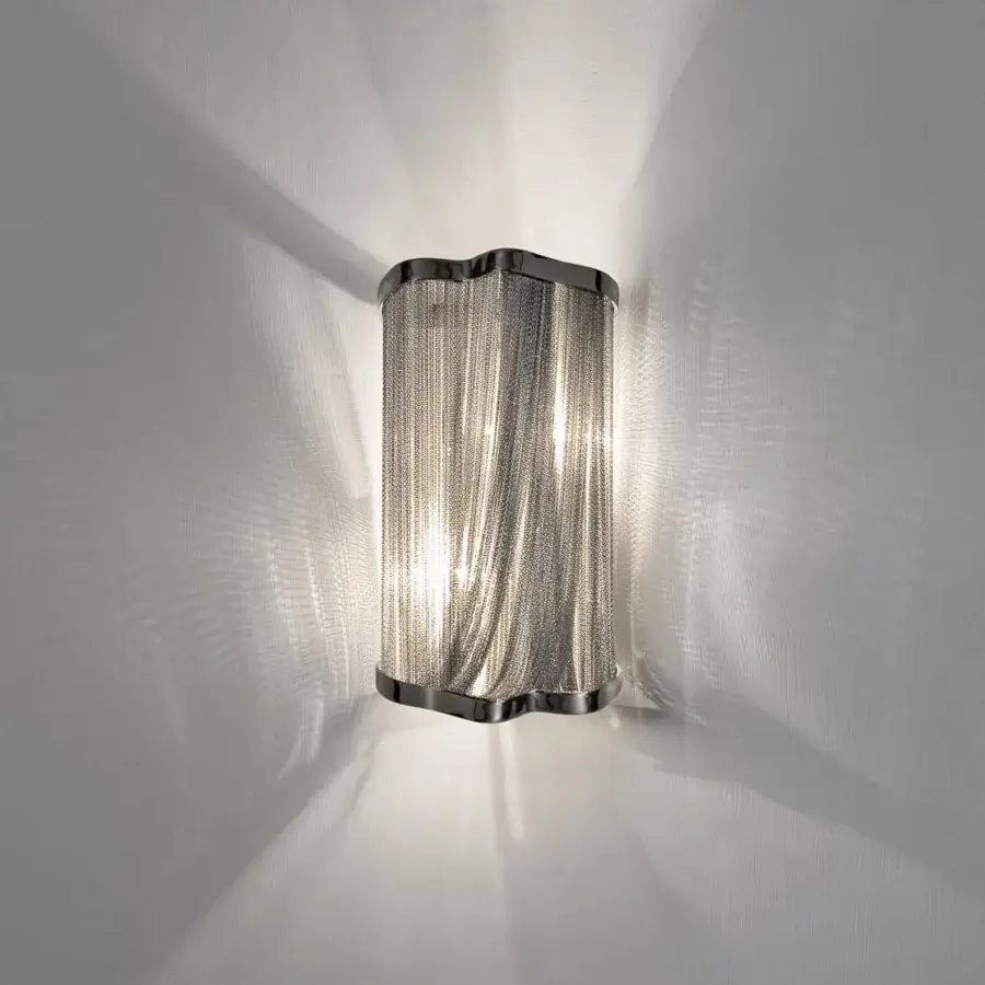 Exceptional Terzani Atlantis wall lamp crafted with hundreds draped hand-crafted brass chains and a glossy silver-toned finish