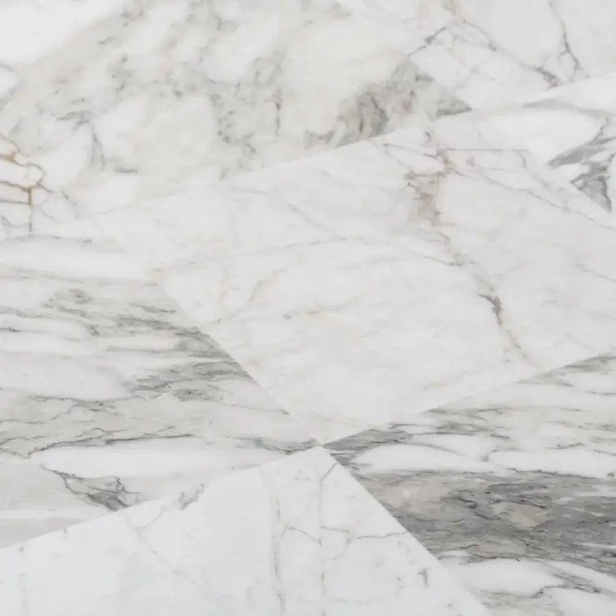 Distinguished Turri Ratio coffee table with a smooth marble top displaying grey patterns and a thin metal structure