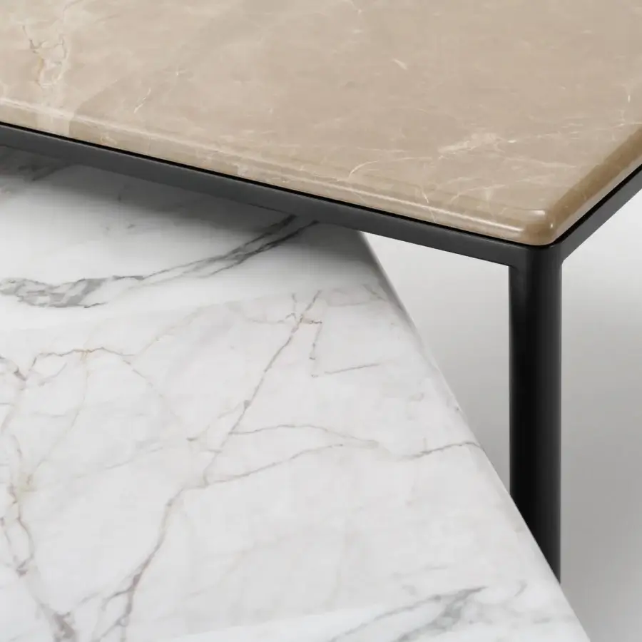 Distinguished Turri Ratio coffee table with a dark metal structure and light beige marble top showcasing subtle veining