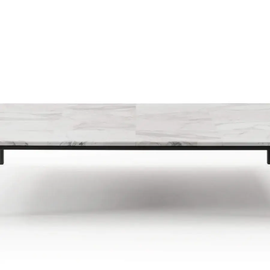 Distinguished Turri Ratio coffee table with a white marble-like patchwork top and thin metal supporting structure