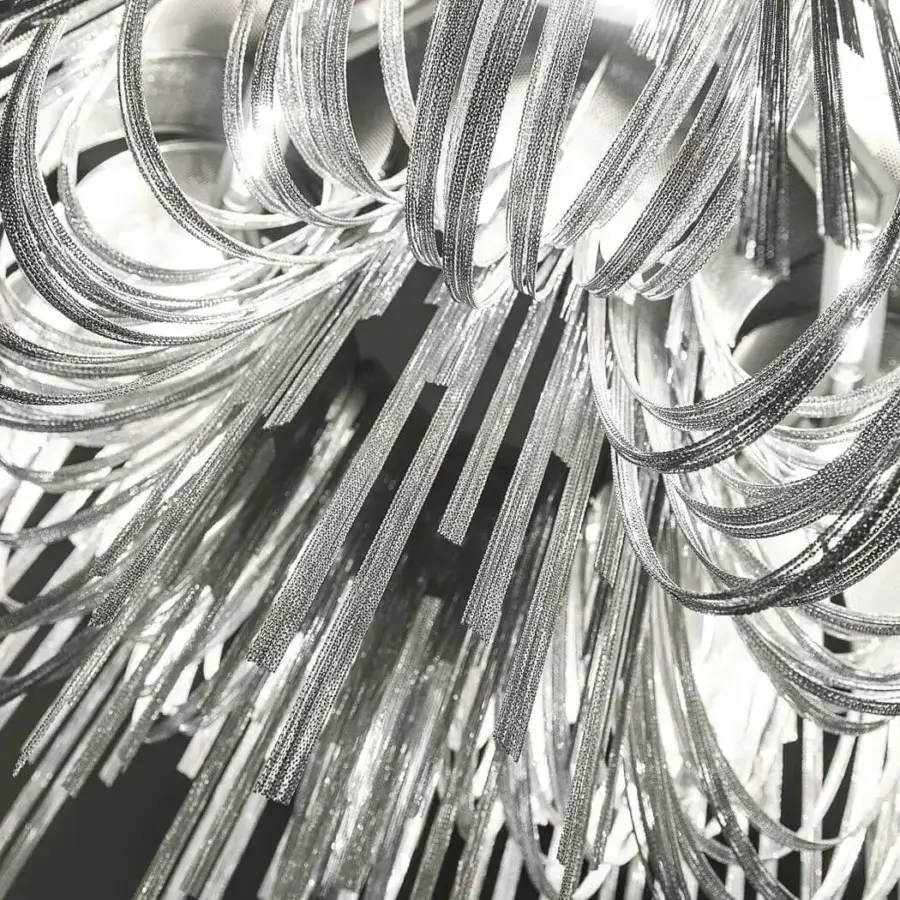 Elegant Terzani Volver suspension lamp with cascading ribbon-like strands crafted in light gray and brass