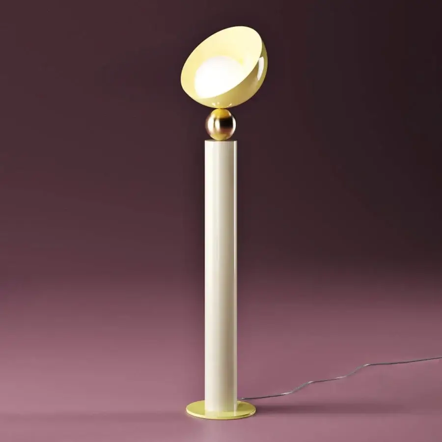 Elegant Italamp Aurora floor lamp with a light gold sphere supporting a pale yellow glass diffuser and decorative metal parts