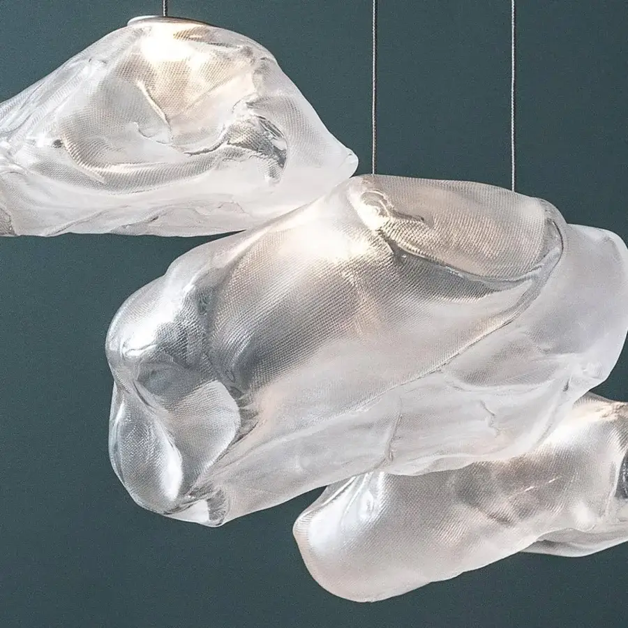 Exclusive Bocci 73 suspension lamp with translucent hand-blown glass pendants creating subtle tonal variations when illuminated
