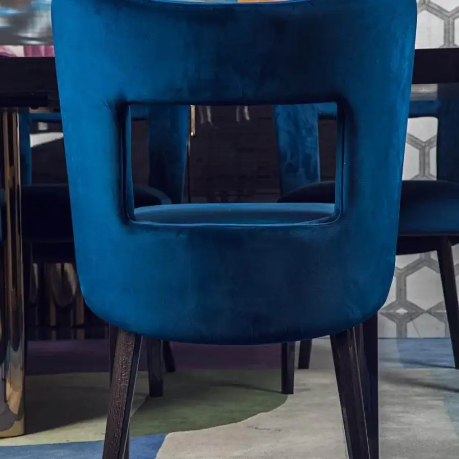 Sophisticated Costantini Pietro Bess chair in plush blue textile with dark tone wood finish and rectangular cutout