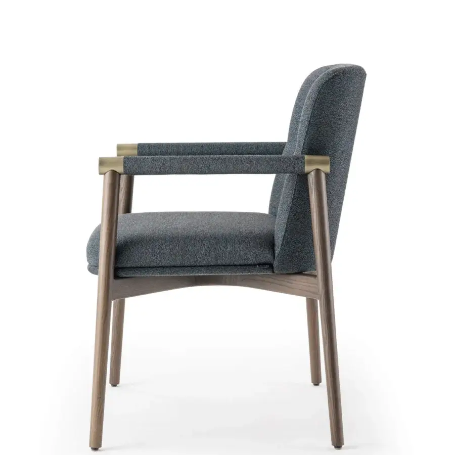Lavish Turri Atelier chair with walnut wood legs, brass details and dark bluish-gray upholstery in matte finish