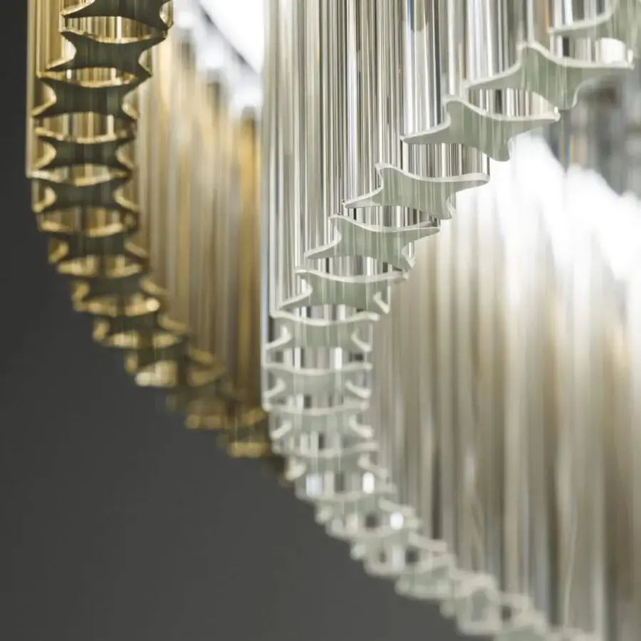 Distinguished Italamp Carmen suspension lamp with a chrome metal structure and refined transparent quadrihedron glass diffusers built with golden rings