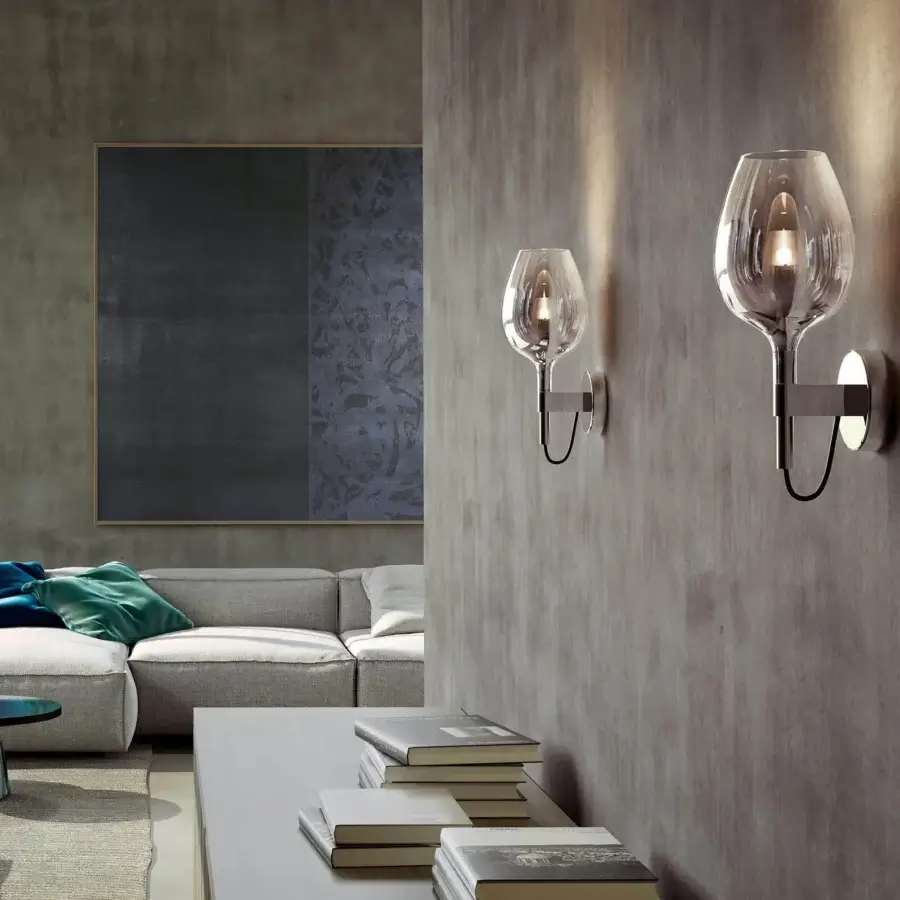 Elegant Italamp Rosè wall lamp with refined transparent glass diffuser and polished silver-toned metal structure
