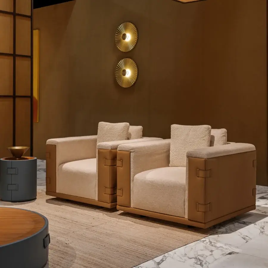 Captivating Turri Atelier lounge chair with light beige textured fabric and rich brown leather detailing