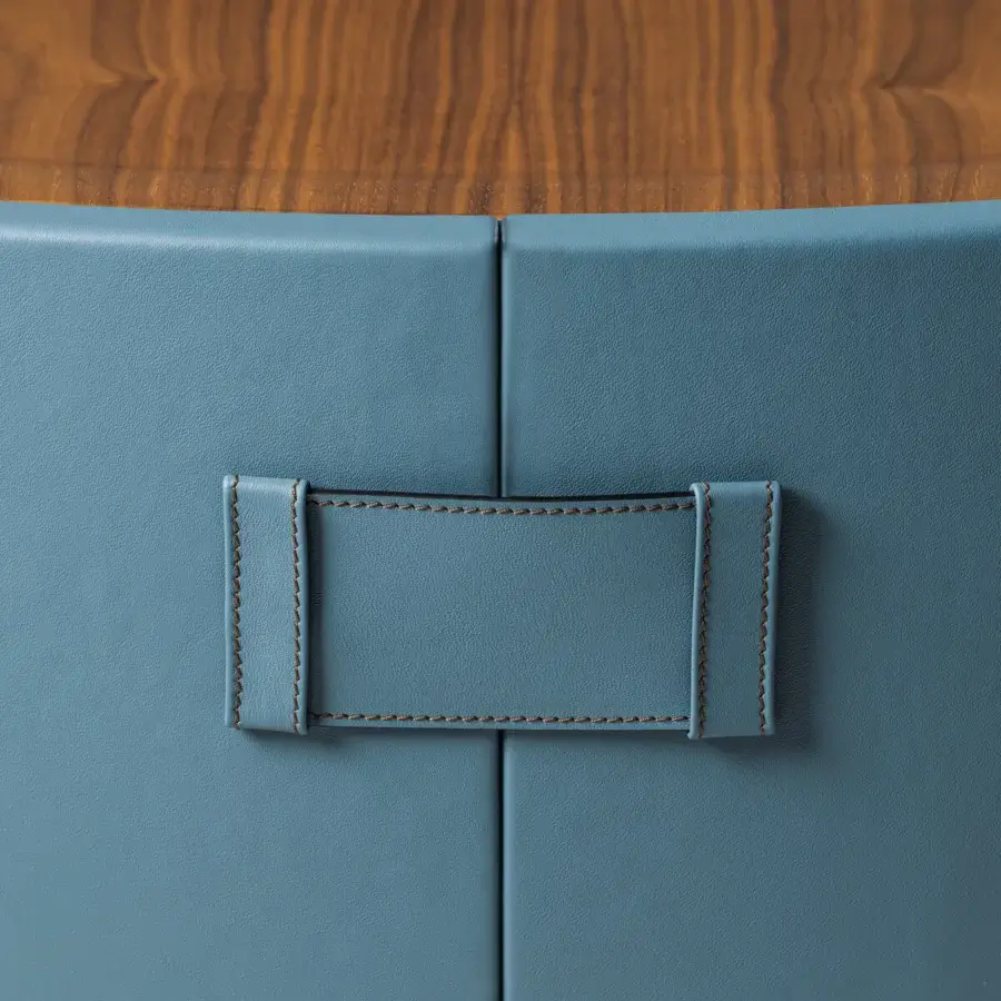 Exceptional Turri Atelier coffee table with walnut wood top and blue leather enveloping a sculpted cylindrical form