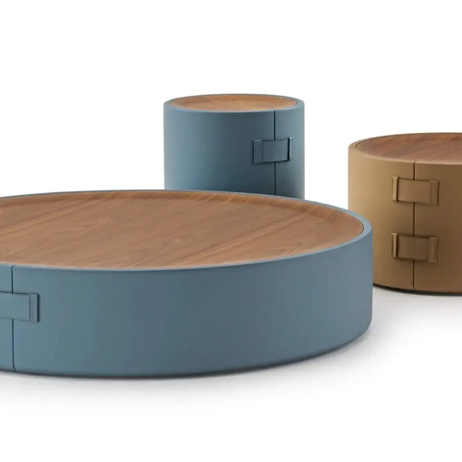 Distinguished Turri Atelier coffee table crafted with walnut wood and tan leather, exhibiting a sleek cylindrical form with buckle accents