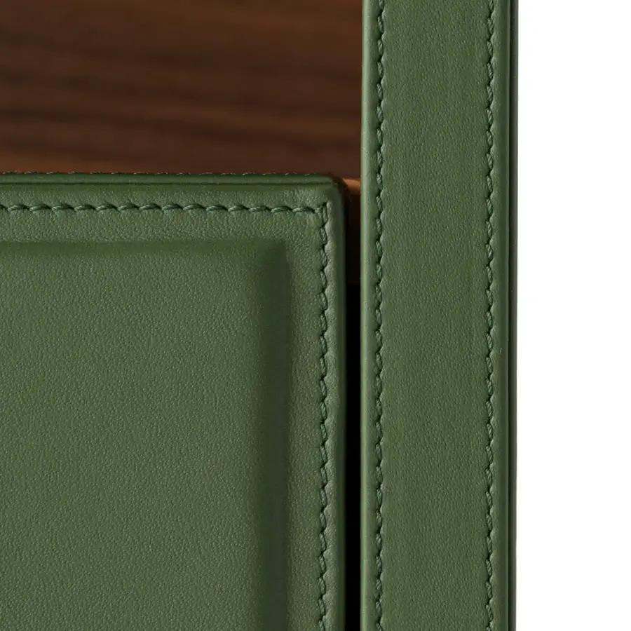 Impeccable Turri Atelier nightstand with soft green leather framing warm walnut wood and precise stitching