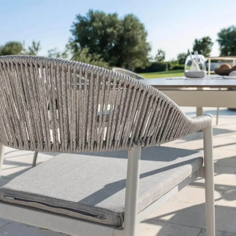 Superior Varaschin Clever armchair with woven textilene and powder-coated aluminum, exhibiting Italian style