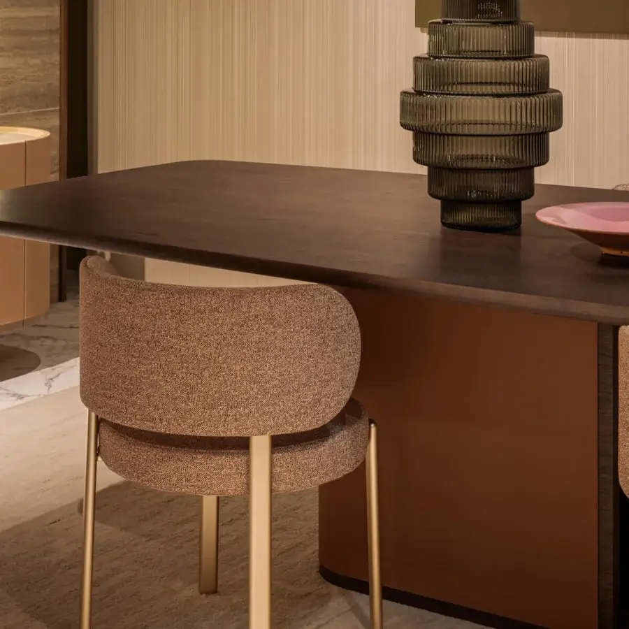 Lavish Turri Echo table crafted in Italy with walnut wood and leather, presenting a dark brown barrel-shaped top with rounded lines