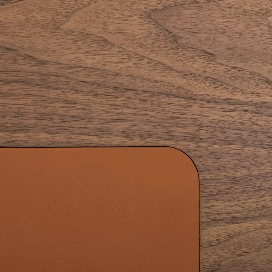 Elegant Turri Echo desk with rounded corners, walnut wood top and smooth brown leather pad