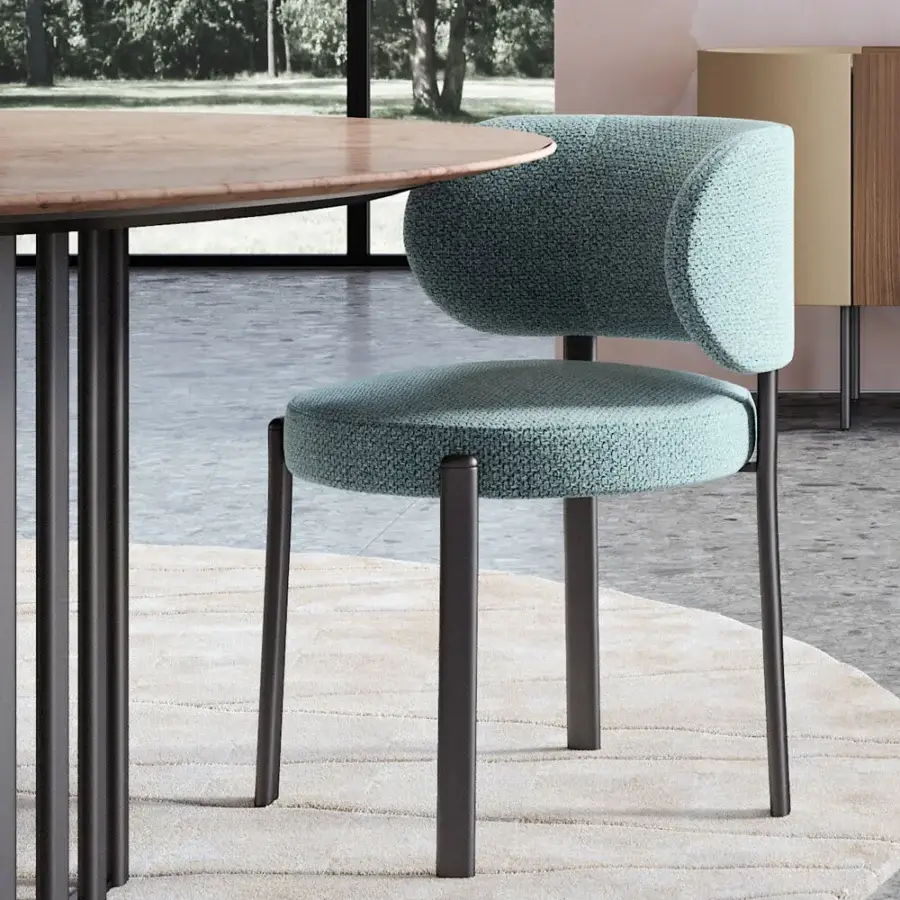 Elegant Turri Roma table with stone-like material top and dark metal base built with vertical rods