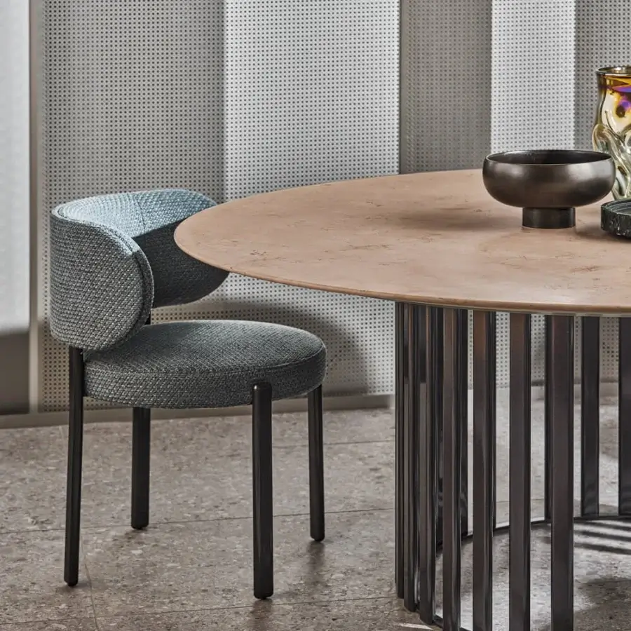 Superior Turri Roma table with a rounded glossy top resembling light stone and a dark metal partial circle base