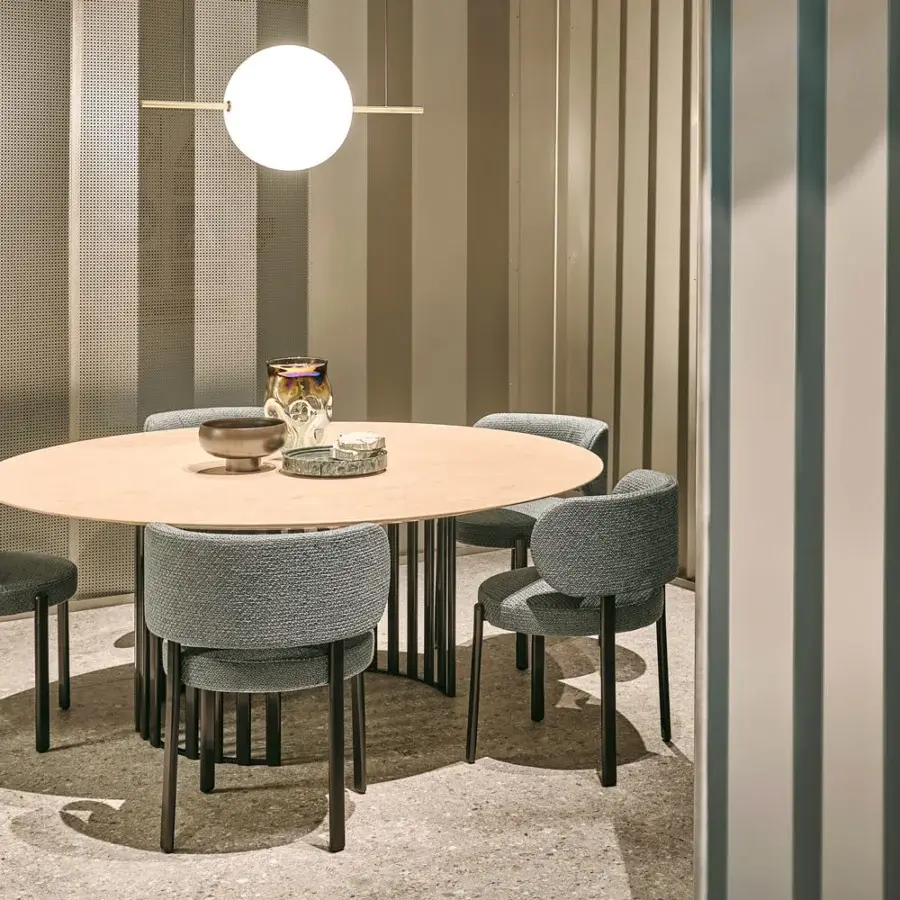 Elegant Turri Roma table with a rounded glossy lacquered wood tabletop and striking vertical metal tube base