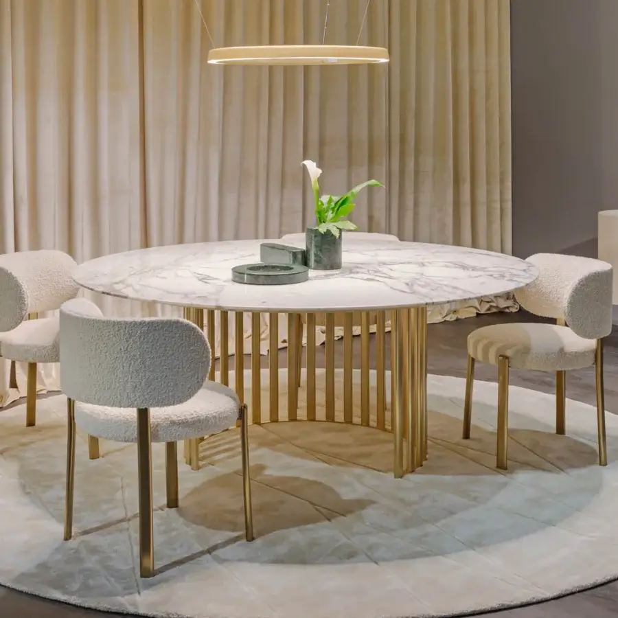 Distinguished Turri Roma table with a round marble top exhibiting grey veining and a golden metal base crafted in a partial circle