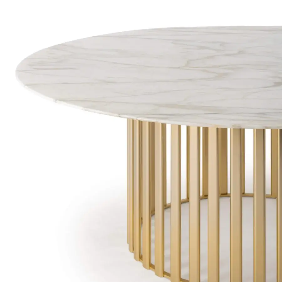 Exceptional Turri Roma table with a round marble top exhibiting warm colored veins and a gold-finished metal base crafted in a circular formation